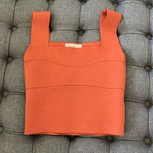 Listicle orange top.